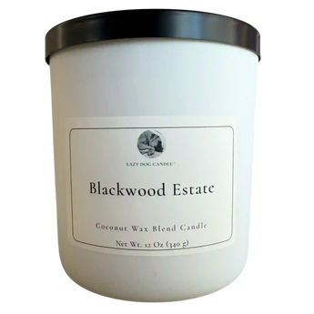 White candle with black lid labeled 'Blackwood Estate' on a white background