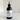 Black body fragrance spray bottle labeled 'Blue Dominion No. 2' on a marble surface.