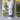 Body powder canister with 'Carioca Nights' label against a blurred window background
