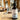 Beard conditioning oil bottle on a wooden surface with a blurred background