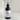 Black body fragrance spray bottle labeled 'Clear Horizon' on a marble surface.