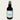 Black bottle of 'Coconut Beach' room & linen spray by Lantern & Veil on a light gray background