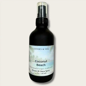 Black bottle of 'Coconut Beach' room & linen spray by Lantern & Veil on a light gray background