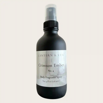 Black body fragrance spray bottle labeled 'Crimson Ember' on a white background