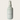 White spray bottle with Crimson Veil fragrance mist by Lantern & Veil on a beige background.