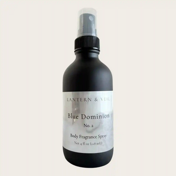Black body fragrance spray bottle labeled 'Blue Dominion No. 2' by Lantern & Veil on a light gray background.