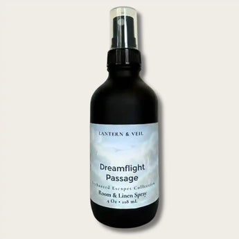 Black spray bottle labeled 'Dreamflight Passage' by Lantern & Veil on a light gray background