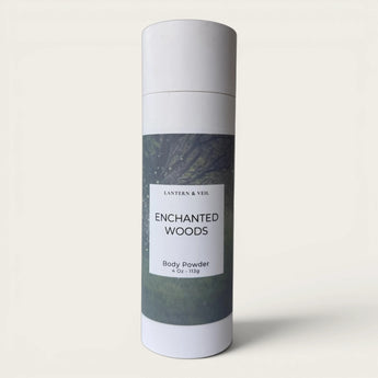 Body powder canister labeled 'Enchanted Woods' on a light gray background