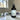 Room spray bottle labeled 'Hidden Grove' with lavender sprigs on a marble surface.