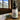 Bottle of Lantern & Veil Beard Conditioning Oil on a wooden surface with a mountain view in the background