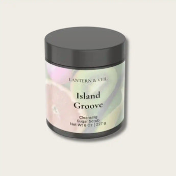 Cleansing sugar scrub jar labeled 'Island Groove' by Lantern & Veil on a light gray background