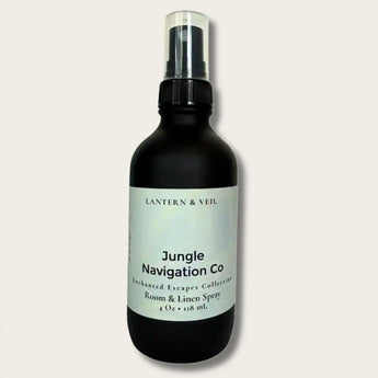 Black room and linen spray bottle labeled 'Jungle Navigation Co' on a light gray background