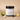 Lantern & Veil Key Lime satin signature lotion jar with lime and lemon slices on a beige background