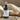 Body fragrance spray bottle labeled 'Solar Drift' by Lantern & Vine on a sandy background.