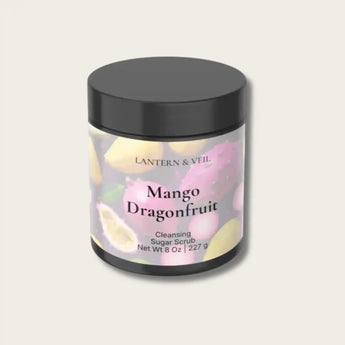 Jar of Mango Dragonfruit Cleansing Sugar Scrub with black lid on a light gray background