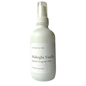 White bottle of 'Midnight Vanilla' fragrance mist on a white background