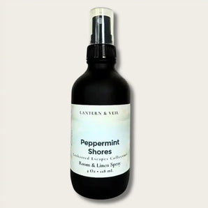 Black spray bottle labeled 'Peppermint Shores' by Lantern & Veil on a light gray background