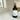 Black spray bottle labeled 'Retro Revival' on a white surface with a blurred background