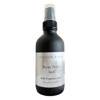 Black body fragrance spray bottle labeled 'Rum Noir' by Lantern & Veil on a white background