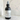 Body fragrance spray bottle labeled 'Rum Noir' by Lantern & Veil on a marble background