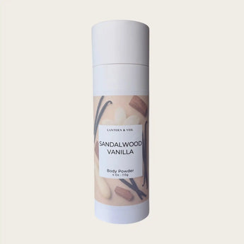 Body powder canister labeled 'Sandalwood Vanilla' on a light beige background