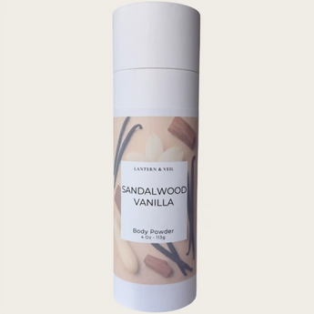 Body powder container labeled 'Sandalwood Vanilla' on a beige background