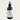 Black body fragrance spray bottle labeled 'Solar Drift' on a light beige background