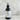 Body fragrance spray bottle labeled 'Storm Skies' on a marble background
