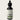 Bottle of Lantern & Veil Beard Conditioning Oil with a dropper on a white background