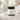 Lantern & Veil Teakwood Island lotion jar on a bathroom counter