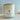 A 12 oz coconut wax blend candle by Lady Dog Candle in a clear glass jar with a light wood bamboo lid and a white label reading 'Tidewater Spa'.