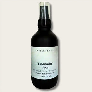 Black spray bottle labeled 'Tidewater Spa' by Lantern & Veil on a light gray background