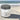 Cleansing sugar scrub container labeled 'Tidewater Spa' by Lantern & Veil on a beach.
