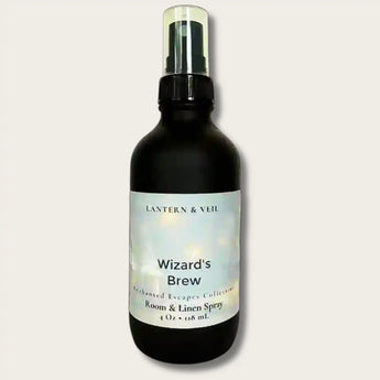 Black spray bottle labeled 'Wizard's Brew' by Lantern & Veil on a light gray background