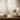 Soft neutral interior with linen textures and warm natural light creating a calm, inviting home fragrance atmosphere