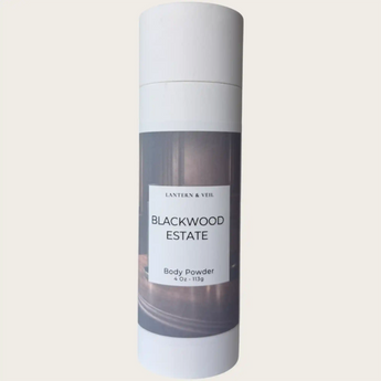 Body powder canister labeled 'Blackwood Estate'  on a beige background