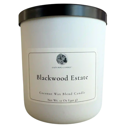 White candle with black lid labeled 'Blackwood Estate' on a white background
