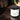 Jar of 'Blackwood Estate' satin signature handmade body lotion on a dark wooden surface.