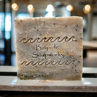 Blush Spell Soap Bar on a bathroom counter with a blurred background