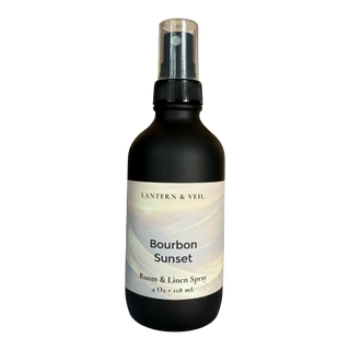 Room and linen spray bottle labeled 'Bourbon Sunset' by Lantern & Veil on a white background