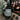 Room & Linen Spray bottle labeled 'Christmas Shop' by Lantern & Veil on a wooden surface with Christmas decorations in the background.