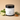 Lantern & Veil Clean Slate lotion jar with a lime and herbs on a beige background