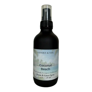 Room and linen spray bottle labeled 'Coconut Beach' by Lantern & Veil on a white background