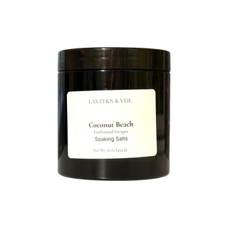 Black container of 'Coconut Beach' soaking salts by Lantern & Veil on a white background