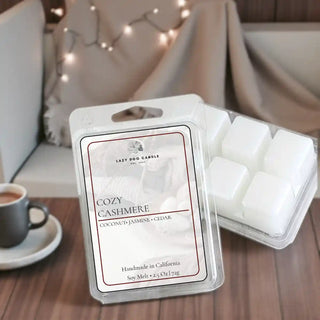Cozy Cashmere soy wax melt displayed on a wooden surface with soft knit blanket and warm ambient lighting