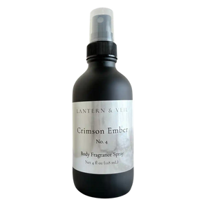 Black body fragrance spray bottle labeled 'Crimson Ember' on a white background