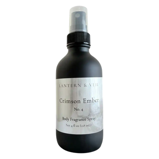 Black body fragrance spray bottle labeled 'Crimson Ember' on a white background