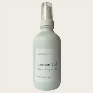 White spray bottle with Crimson Veil fragrance mist by Lantern & Veil on a beige background.