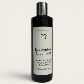 Bottle of Eucalyptus Spearmint dog wash with a white label on a light gray background