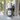 Body powder container labeled 'Enchanted Woods' on a surface with a blurred window background.
